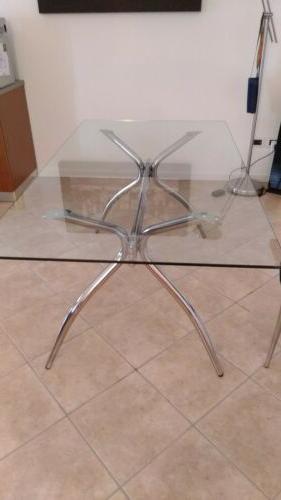 tavolo da pranzo in vetro e acciaio